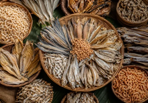 Assorted dry fish (shutki) displayed on a clean plate with natural lighting